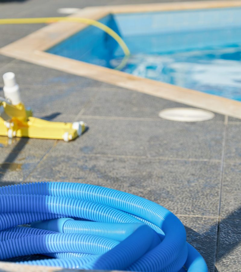 Water vacuum cleaner for cleaning the pool. Details of cleaner near an outdoor pool, nobody